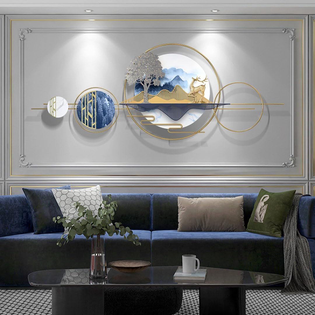 Decorative wall art above a blue sofa in a living room setting.