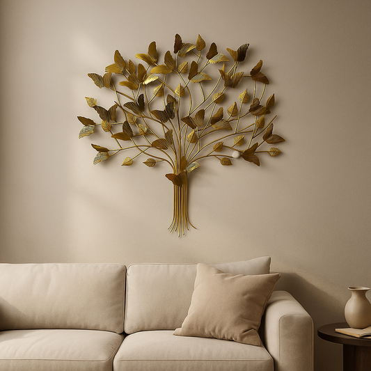 Decorative metal tree wall art on a beige wall above a beige sofa.