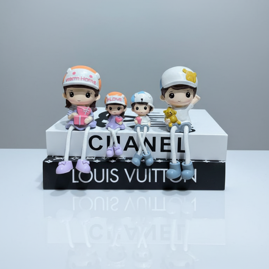 Toy figurines on a Chanel and Louis Vuitton display stand with a gray background
