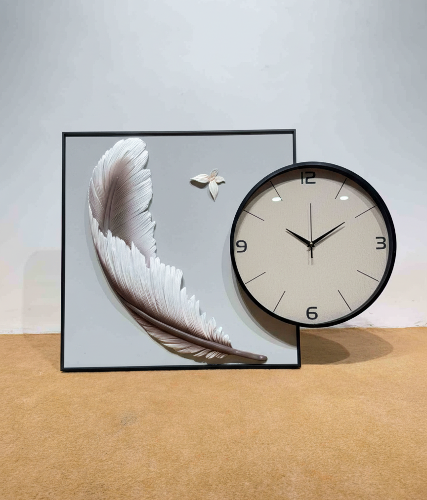 Decorative wall clock with feather design on a light background