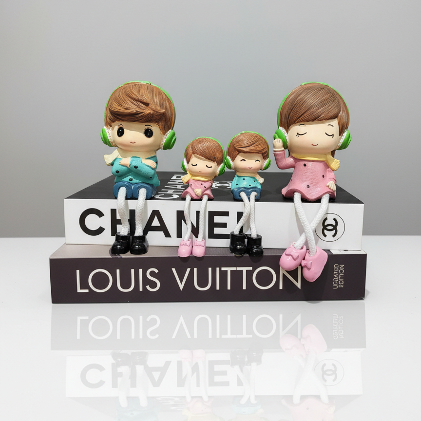 Toy figures on top of Chanel and Louis Vuitton boxes with a gray background