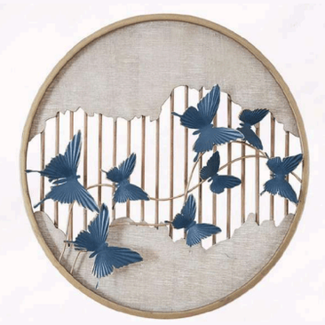 Decorative wall art with blue butterfly shapes on a circular wooden frame.